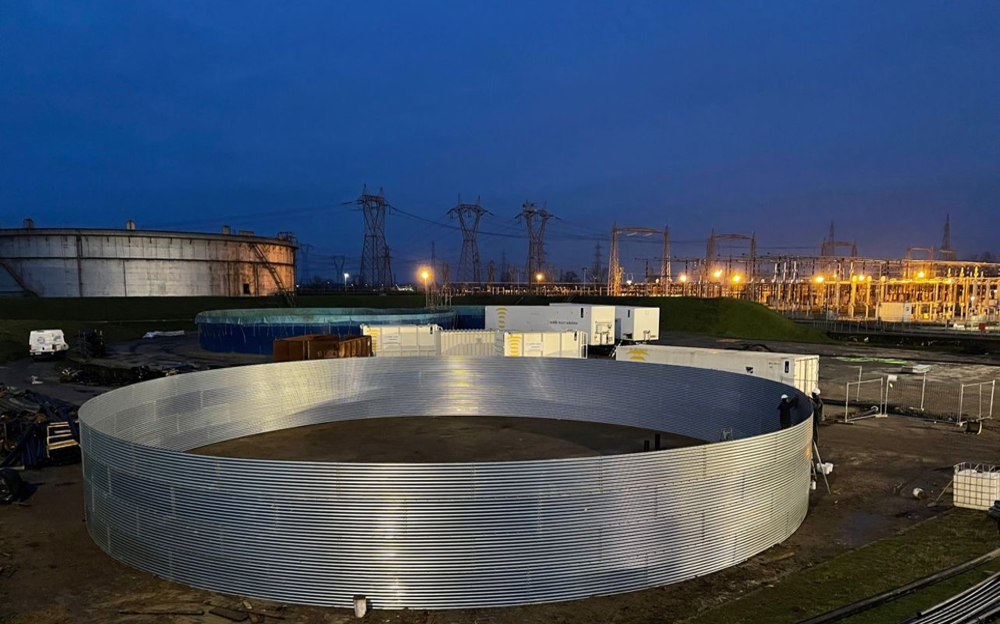 Image of steel tanks at night